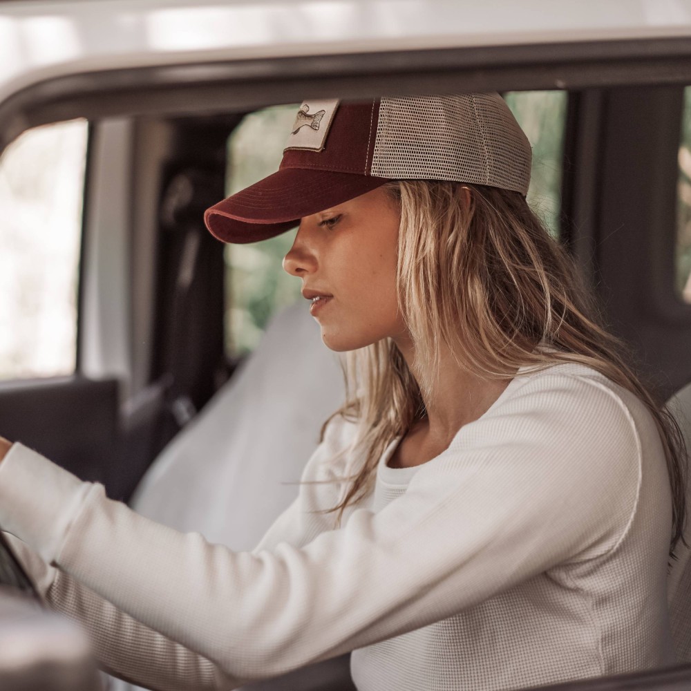 Our trucker cap fits comfortably on your head, with an adjustable strap at the back. 